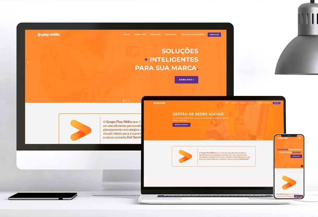 Play Midia website mockup. It contains a monitor, a laptop and a smartphone showing their website.